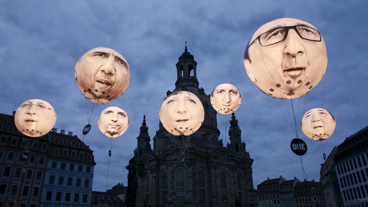 Balloons made by the 'ONE' campaigning organisation depicting leaders of the countries members of the G7 are seen in front of the Frauenkirche cathedral in 2015.