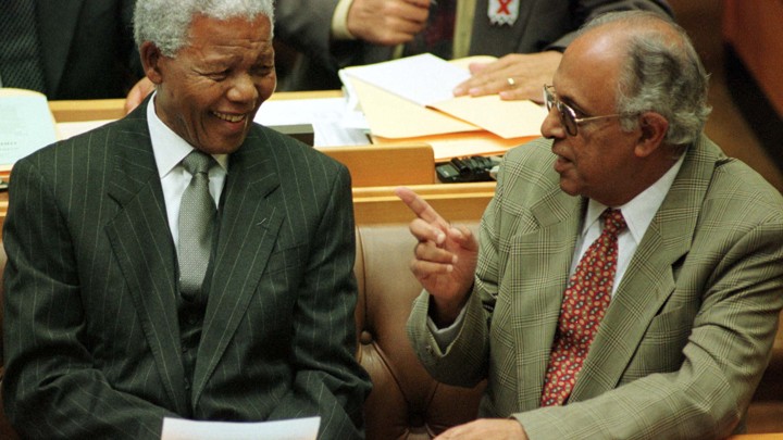 President Nelson Mandela talks to fellow veteran politician Ahmed Kathrada.