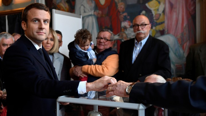 Emmanuel Macron casts his ballot in the first round of French presidential election at a polling station in Le Touquet, France on April 23, 2017.
