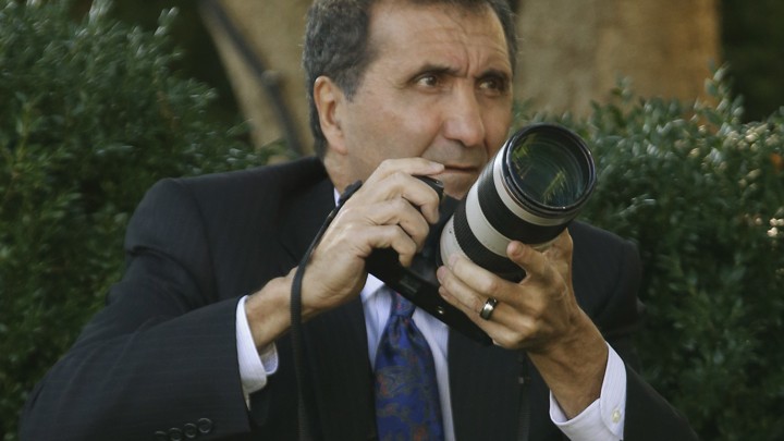 Pete Souza, the former director of White House photography, takes pictures of Barack Obama in the Rose Garden in 2013.