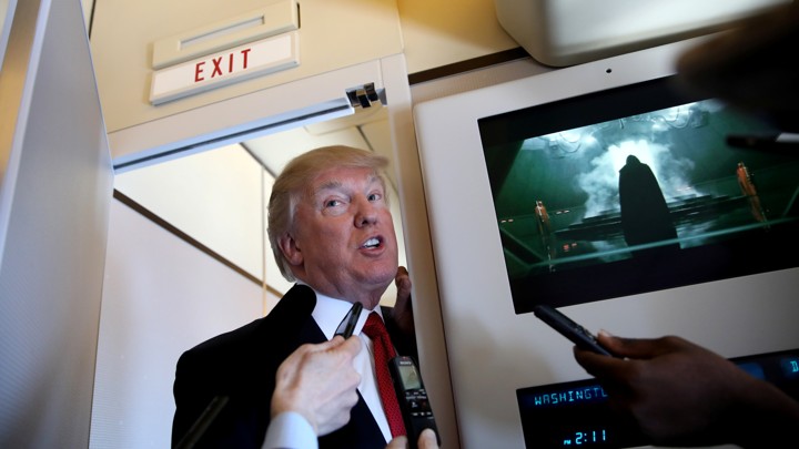 Donald Trump speaks on board Air Force One on Thursday
