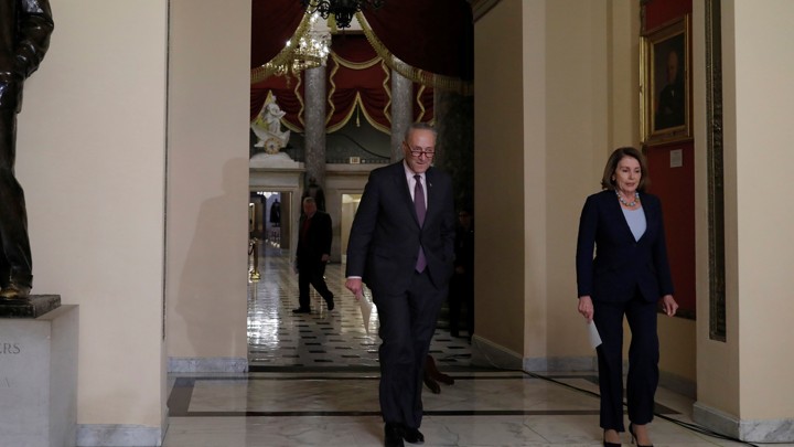 Democratic leaders Chuck Schumer and House Nancy Pelosi arrive at a news conference in Washington.