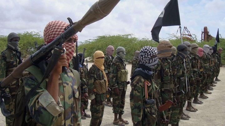 Al-Shabaab fighters display weapons as they conduct military exercises in northern Mogadishu, Somalia.