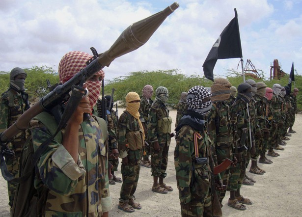 Al-Shabaab fighters display weapons as they conduct military exercises in northern Mogadishu, Somalia.