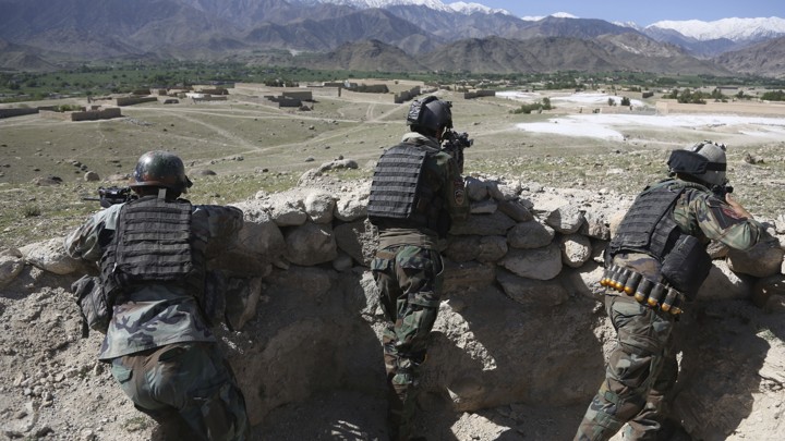 Afghan commandos are positioned in Pandola village near the site of a U.S. bombing in the Achin district of Jalalabad, Afghanistan.