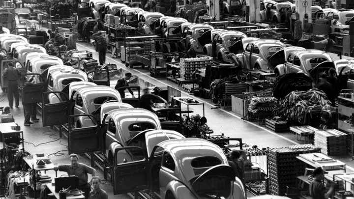 Beetles are assembled on production lines at Volkswagen's Wolfsburg, West Germany, plant in 1954.