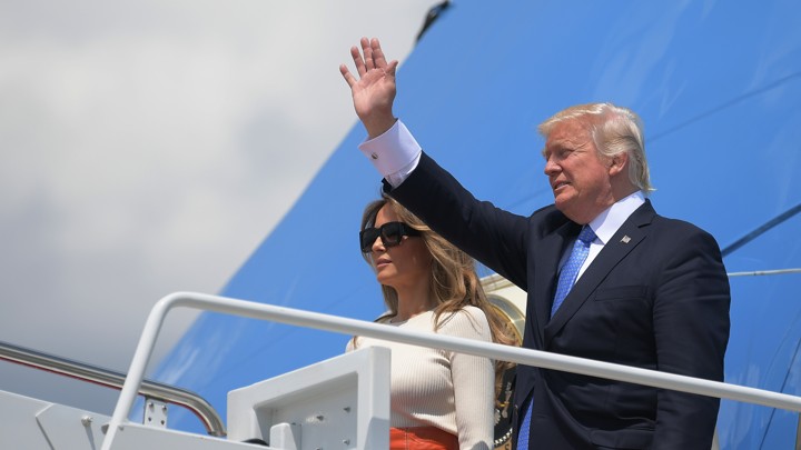 President Donald Trump and First Lady Melania Trump make their way to board Air Force One before departing from Andrews Air Force Base in Maryland on May 19, 2017.