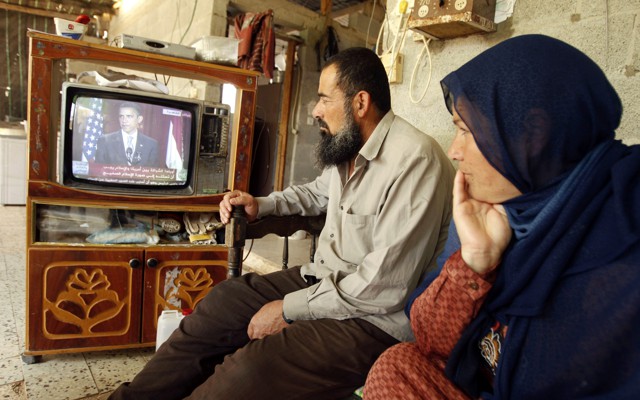 Palestinians in Khan Younis watch Barack Obama speak in Cairo on June 4, 2009.