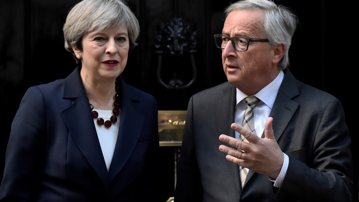 Britain's Prime Minister Theresa May welcomes Head of the European Commission, President Jean-Claude Juncker to Downing Street on April 26, 2017.