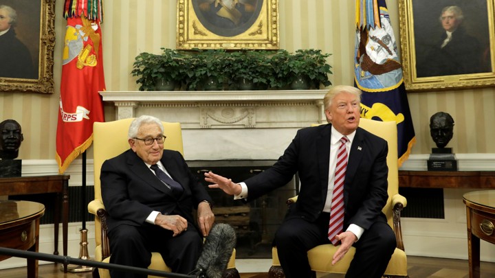 Donald Trump and Henry Kissinger meet in the Oval Office on May 10.
