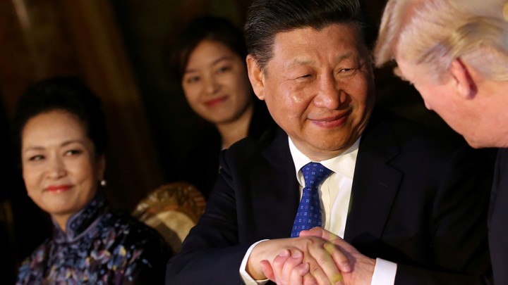 Chinese President Xi Jinping shakes hands with U.S. President Donald Trump.