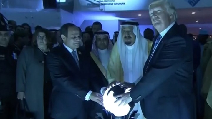 Donald Trump places his hands on a glowing orb in Riyadh, Saudi Arabia, in May 2017.