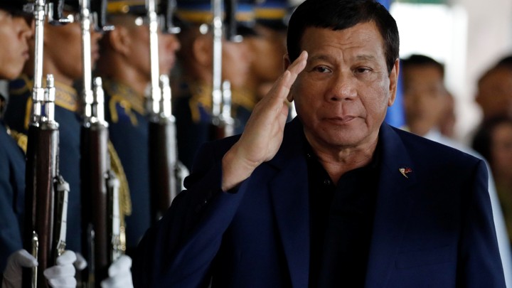Philippine President Rodrigo Duterte salutes honor guards upon arrival from Russia at the Ninoy Aquino International airport in Manila, Philippines on May 24, 2017.