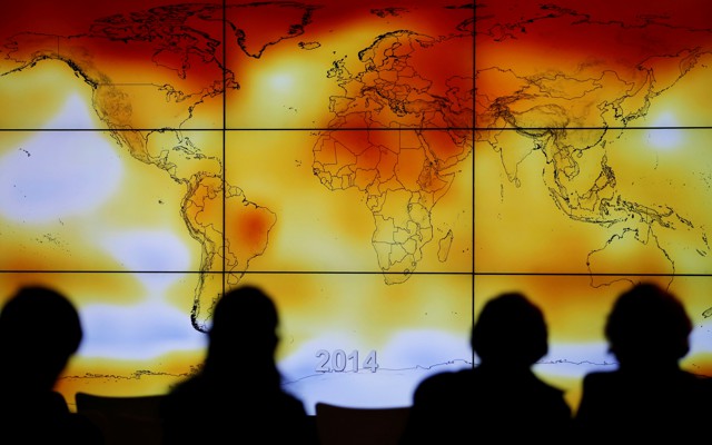 A screen showing a world map with climate anomalies during the World Climate Change Conference 2015 (COP21) at Le Bourget, near Paris, on December 8, 2015
