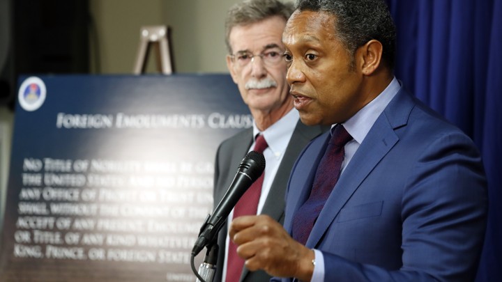 Brian Frosh and Karl Racine, the attorneys general of Maryland and Washington, D.C., announcing their lawsuit against President Donald Trump