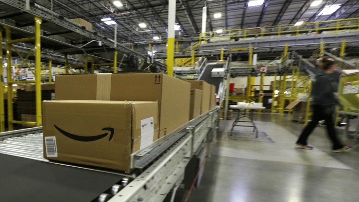 Packages on a conveyor belt at an Amazon warehouse