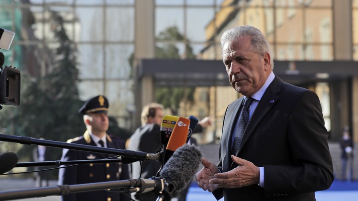 The EU Migration Commissioner answers reporters' questions as he arrives for a meeting on migration in Rome on March 20, 2017.