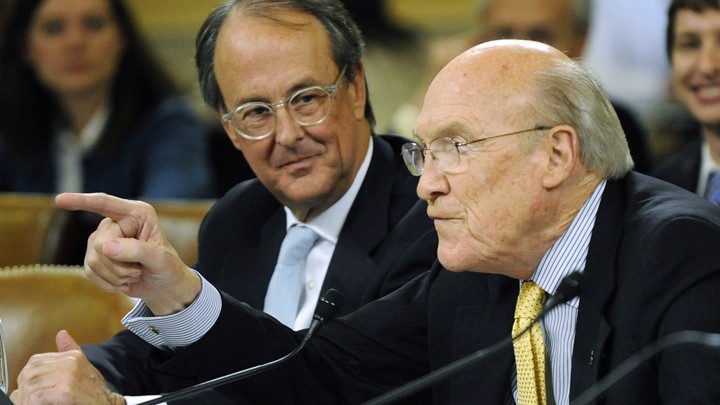 Alan Simpson speaks as Erskine Bowles looks on