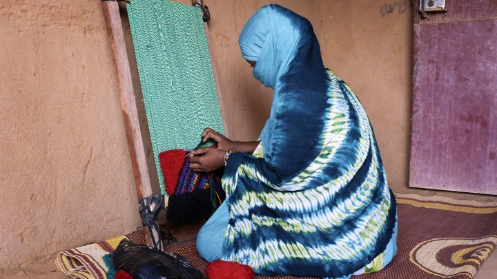 A woman weaving in Mali
