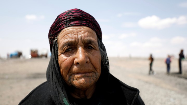 An internally displaced woman who fled Raqqa city is seen inside a camp in Ain Issa, on Syria May 4, 2017.