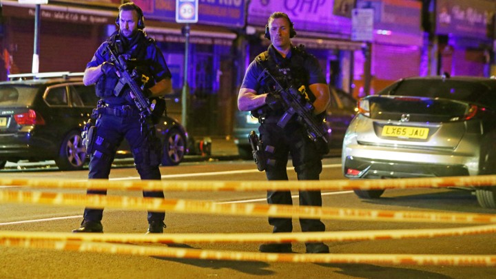 Police officers attend to the scene after a vehicle collided with pedestrians in Finsbury Park on June 19, 2017.