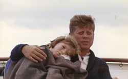 President John F. Kennedy sits on a yacht with his daughter Caroline off Hyannis Port, Massachusetts, in August 1963.