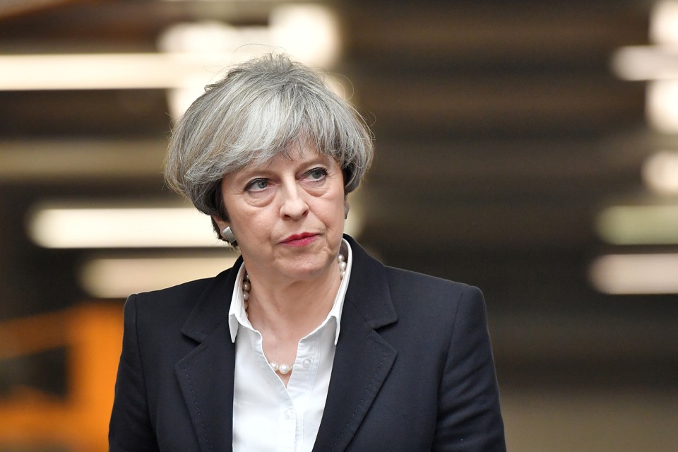 Prime Minister Theresa May looks on during a general election campaign visit to a tool factory in Kelso, Scotland, on June 5, 2017. 