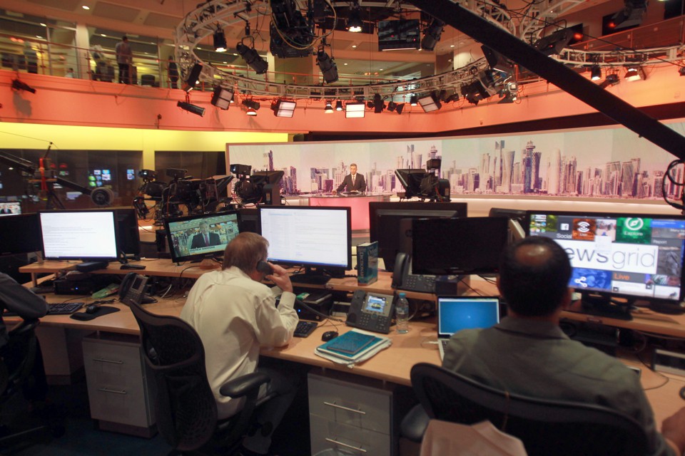 Staff work inside the headquarters of Al Jazeera Media Network in Doha, Qatar, on June 8, 2017.