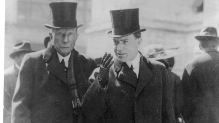 John D. Rockefeller, left, with his son, circa 1915