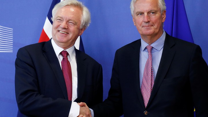 The EU's chief Brexit negotiator, Michael Barnier, welcomes the UK's Brexit secretary, David Davis.