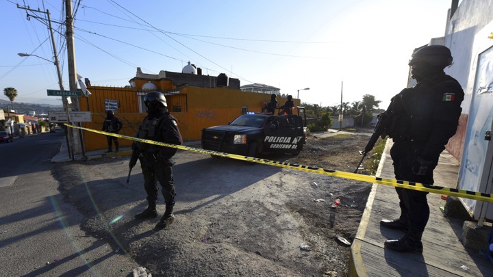 Mexico state police guard the area after a gun battle earlier this year in the the state of Nayarit.