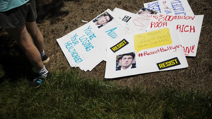 Anti-Paul Ryan signs lay on the ground during a protest in Georgia in May.