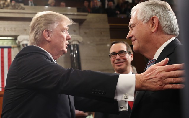 Donald Trump greets Treasury Secretary Steven Mnuchin and Secretary of State Rex Tillerson.