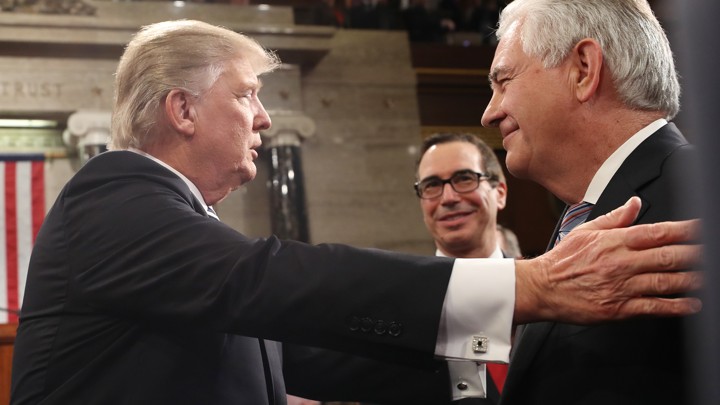 Donald Trump greets Treasury Secretary Steven Mnuchin and Secretary of State Rex Tillerson.