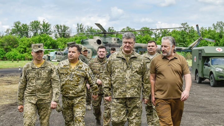 Ukrainian President Petro Poroshenko meets with servicemen during his visit to Donetsk region, Ukraine on June 14, 2017.