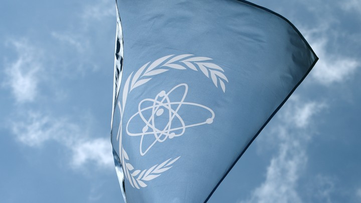 The flag of the IAEA flies in front of its headquarters in Vienna