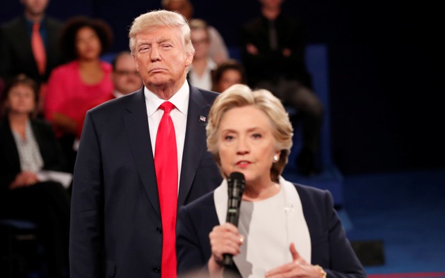 Donald Trump watches Hillary Clinton during a 2016 presidential debate.