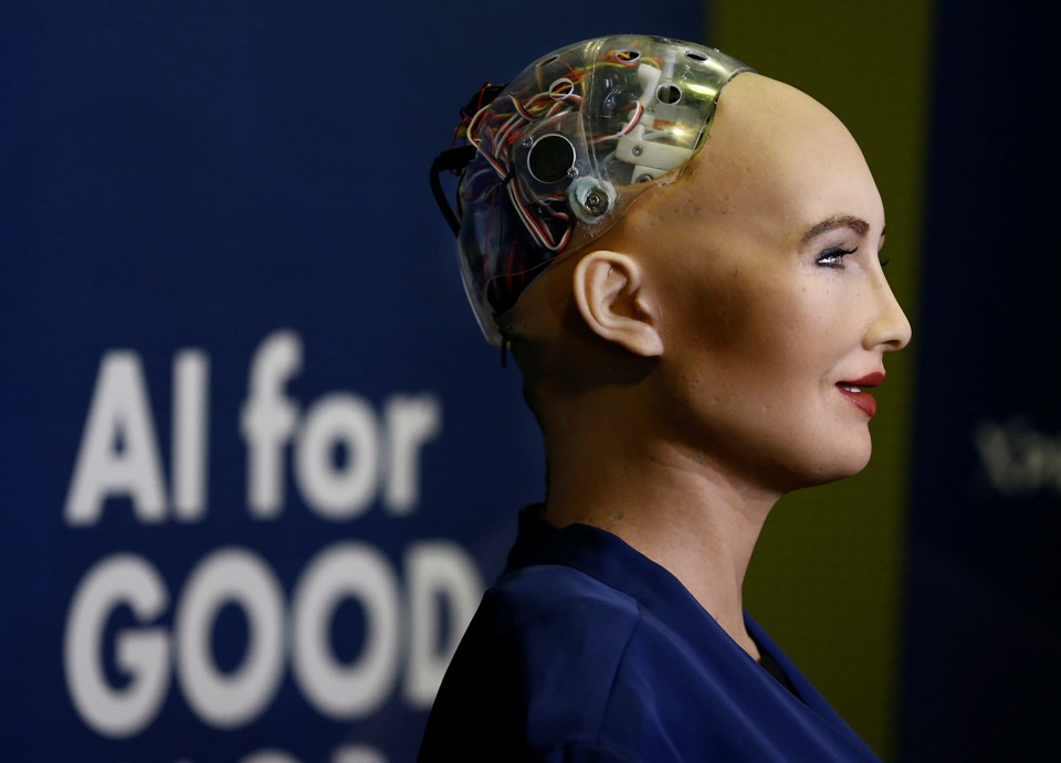 A humanoid robot with wires exposed at the back of the skull