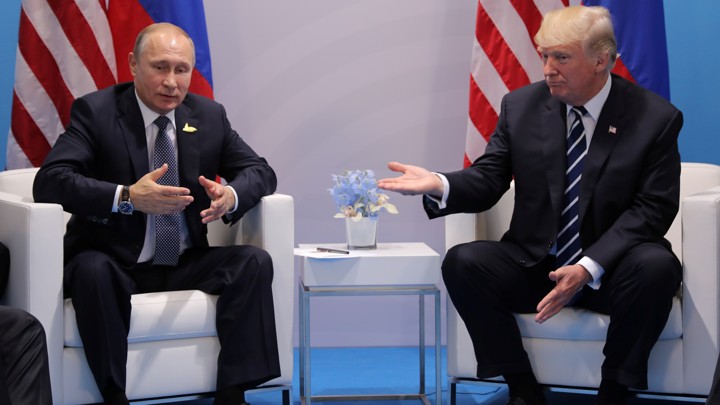 Russia's President Vladimir Putin talks to U.S. President Donald Trump