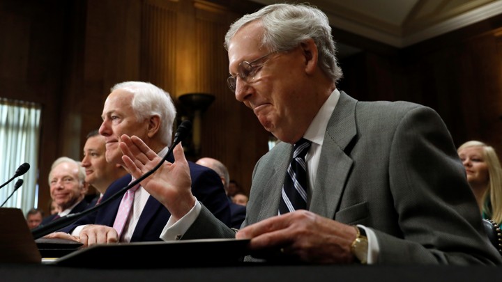 Mitch McConnell, the Senate majority leader, at a microphone