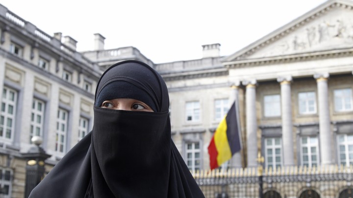 A woman wearing the niqab is pictured outside the Belgian Parliament in Brussels on April 26, 2010.