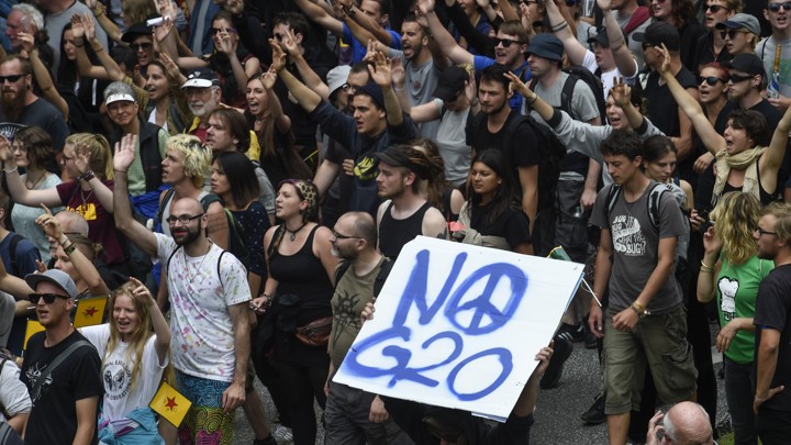 Protesters hold a placard that reads 'No G20' during demonstrations at the G20 summit in Hamburg, Germany.