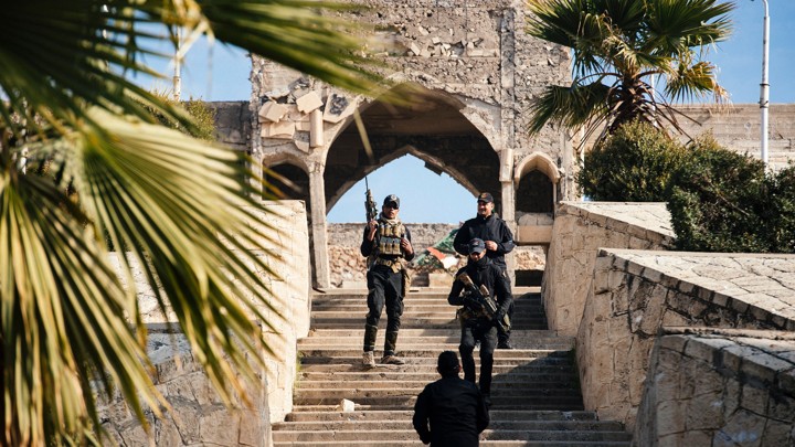 Members of the Iraqi special forces Counter Terrorism Service stand guard in front of Jonah's Tomb in Mosul on January 18, 2017.