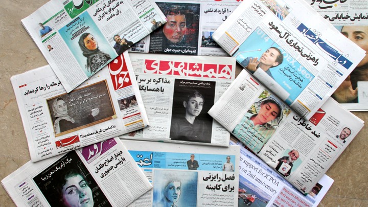 A picture taken in Tehran shows the front pages of Iranian newspapers bearing portraits of Maryam Mirzakhani.