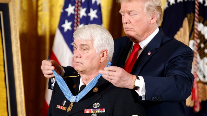 President Donald Trump awards the Medal of Honor to James McCloughan at a ceremony on July 31, 2017.