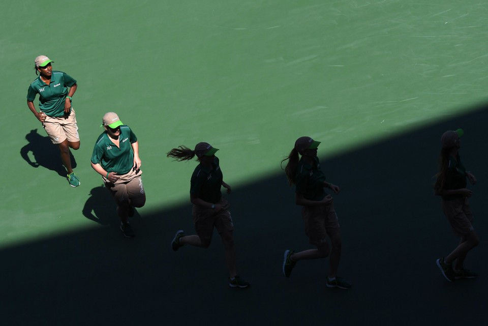 Five female tennis players are running.  