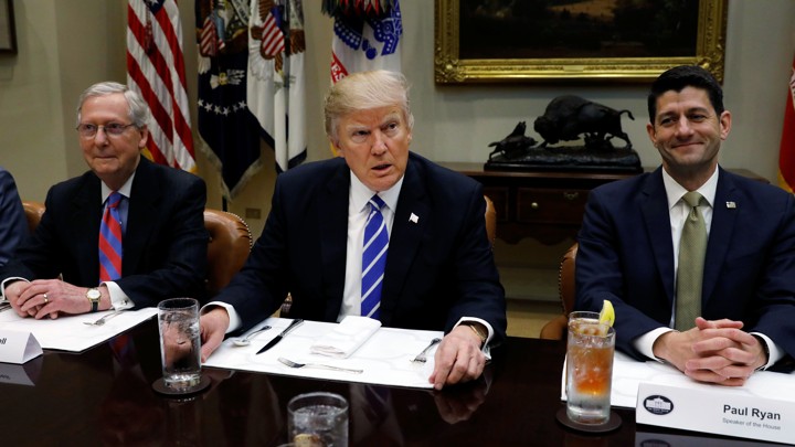 Mitch McConnell, Donald Trump, and Paul Ryan sit at dinner together.