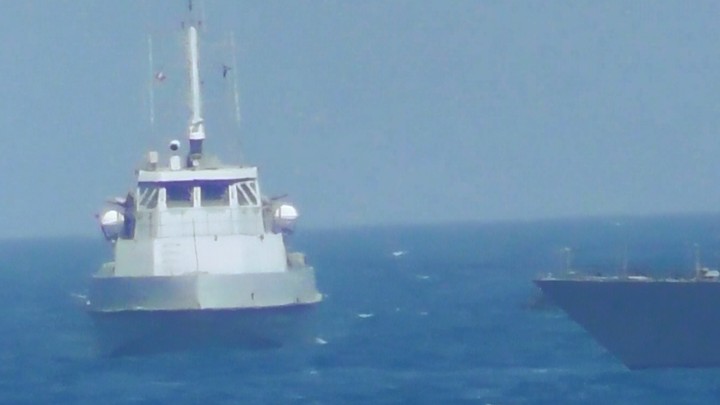 An Iranian vessel steers close to the USS Thunderbolt on July 25, 2017.