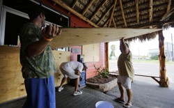 Business owners in Port Aransas, Texas, board up in expectation of Hurricane Harvey.
