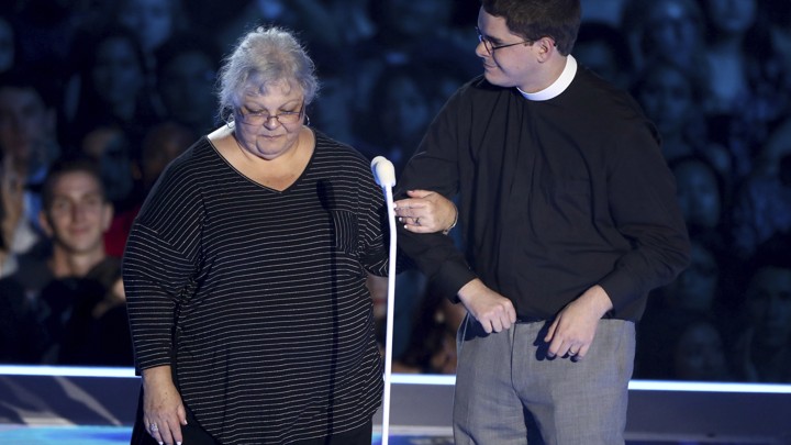 Susan Bro, mother of Charlottesville victim Heather Heyer, and Rev. Robert Lee IV present the award for Best Fight Against the System at the MTV VMAs